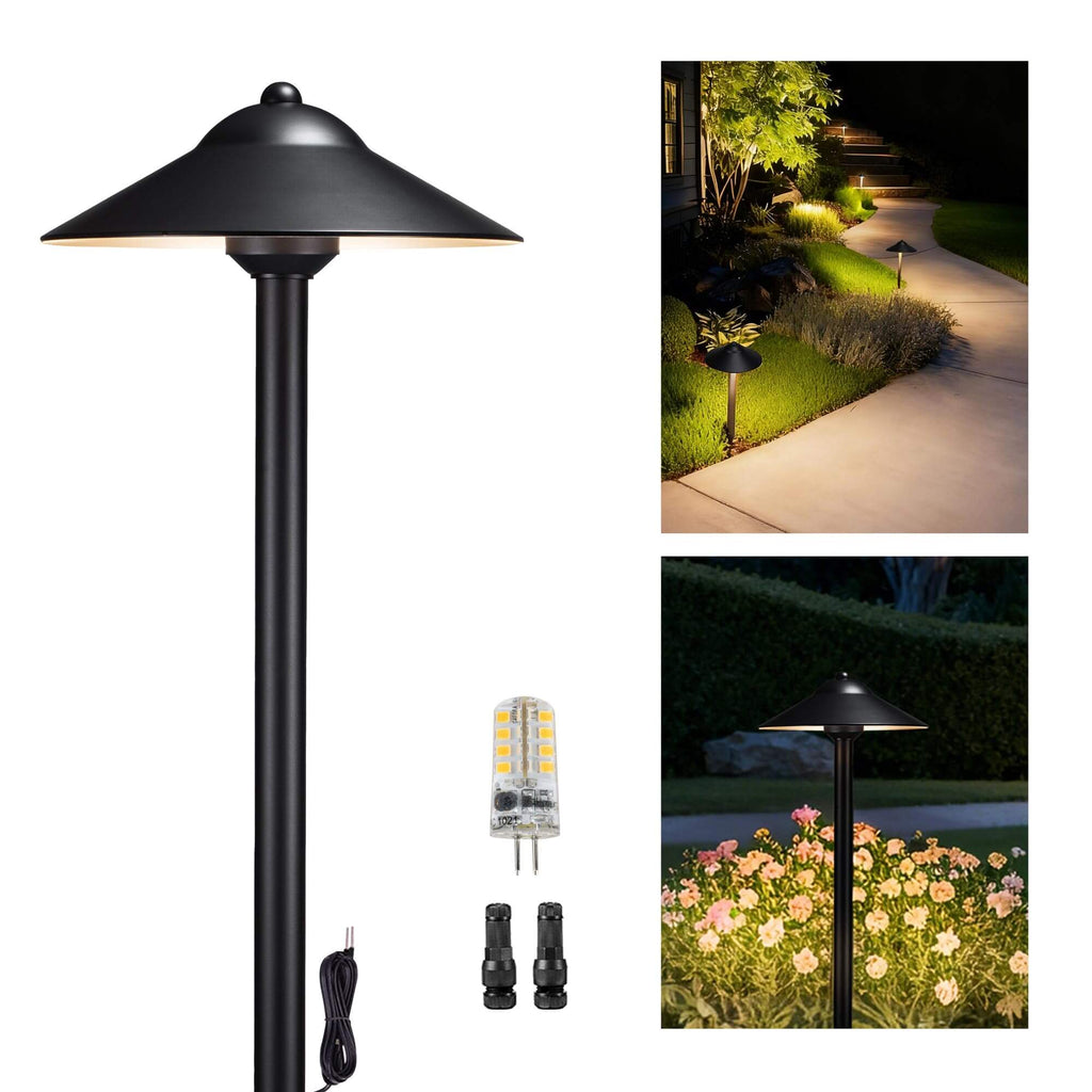 Brass path light mounted on garden and walkway, illuminating the area with soft white light.