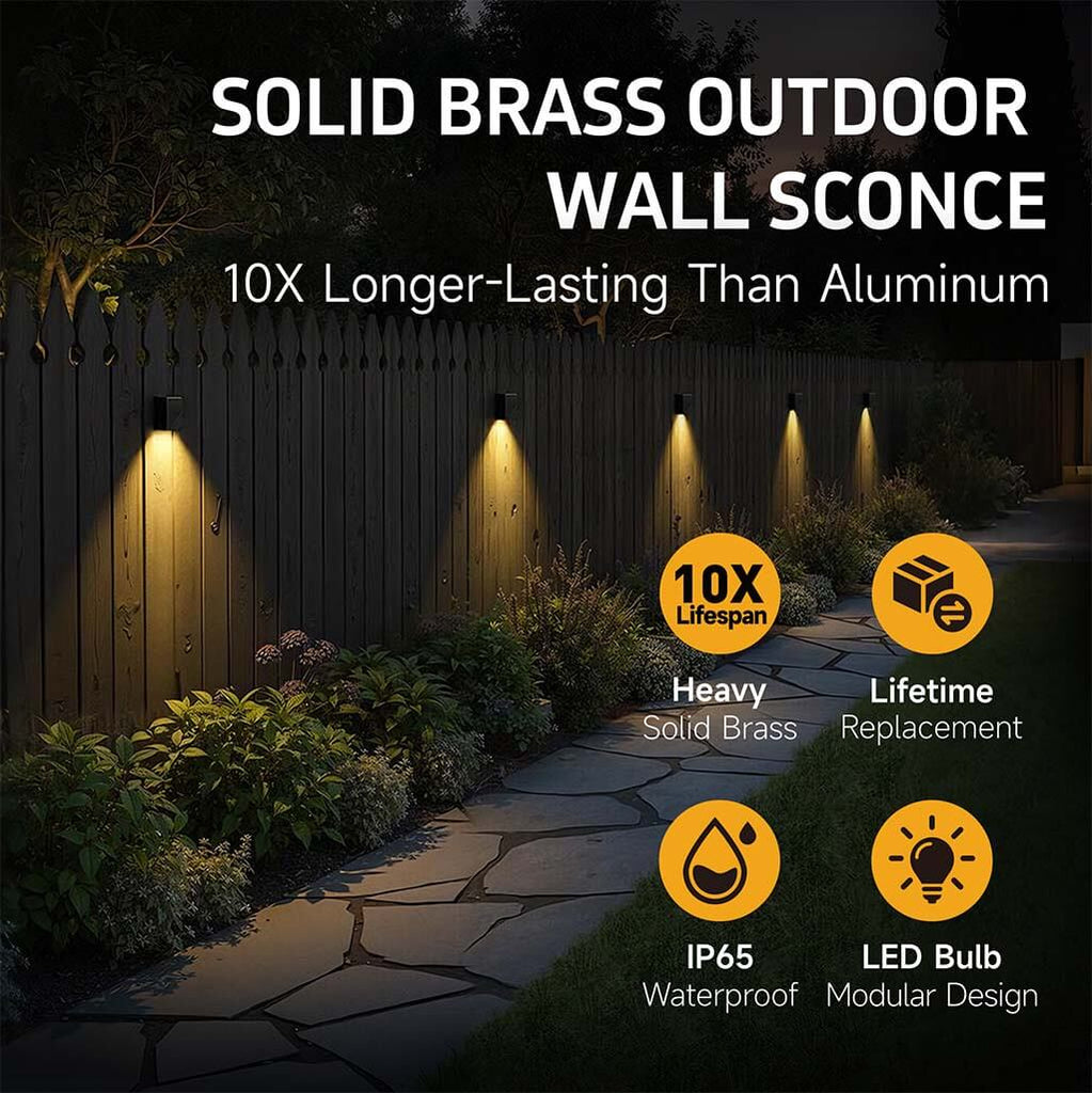 A solid brass low voltage deck light mounted on a wooden fence, casting warm light, highlighting its 12V, waterproof, and lifetime warranty features.